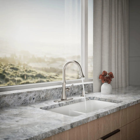 Kaori Single Handle Kitchen Faucet With Pull Down Sprayer And Soap Dispenser In Vibrant Stainless Finish on marble countertop