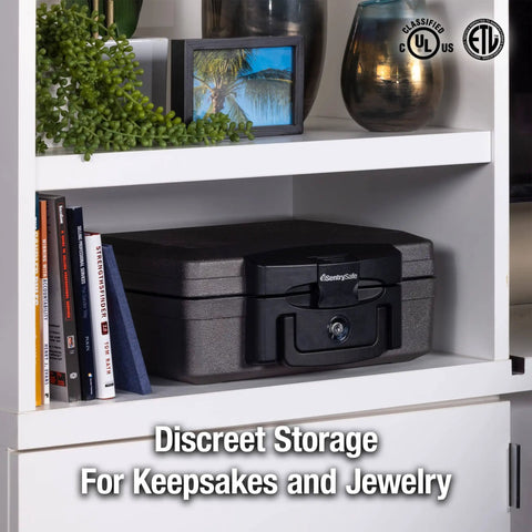 Fireproof And Waterproof Portable Safe Lock Box With Key Lock And Carrying Handle For Money Passport And Valuables Exterior Size 14.3 In W 13 In D 6.1 In H Travel Ready placed on a shelf among books.