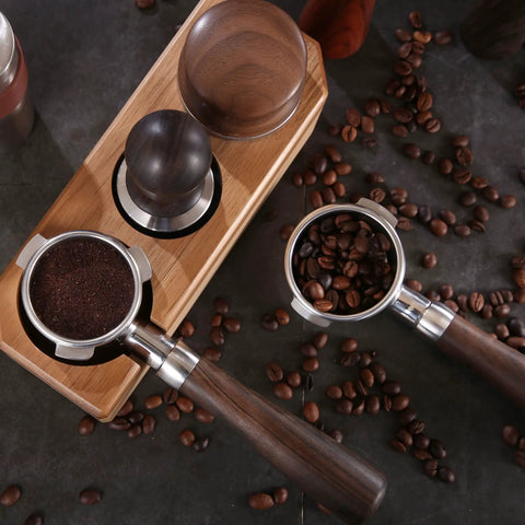 58mm Bottomless Portafilter Featuring Smooth Wood Ergonomic Handle And Double Shot Filter Basket For Breville Oracle Espresso Machines with ground coffee.