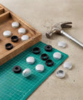 Tough As Nails Eight Pack Silver License Plate Screw Caps Durable Plastic Bolt Covers displayed with a hammer and tray.