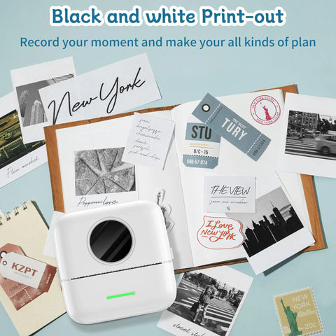 Compact Inkless Thermal Printer With Instant Bluetooth Sync And One Starter Roll Of Sticky Labels on table with printed black and white notes.