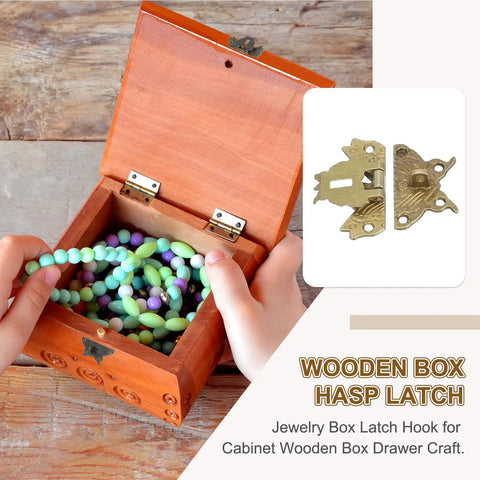 Heavy Duty Vintage Butterfly Hasp Latch Kit For Decorative Wooden Boxes And Jewelry Cases Boasting A Hella Nice Yellow Bronze Finish with beads visible in a wooden box.