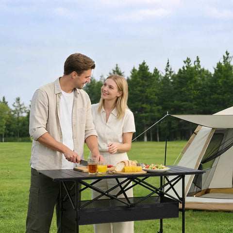 Portable Folding Camping Table With Carry Bag And Detachable Storage Pockets For Beach, Backyard, Picnics And BBQs with couple