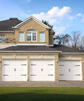 Decorative Carriage House Style Garage Door Hardware Kit With 8 Hinges And 4 Handles For Two Car Garages installed on white doors