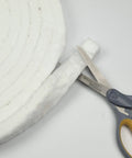 Lynn Manufacturing ceramic fiber blanket strip, 1in x 1/2in x 300in, white gasket material, close-up view