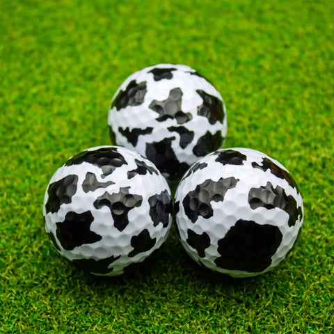 Cow Print Golf Balls 360 Degree Full Wrap Color Set For Gifts Tournaments And Keepsakes 12 Pack Novelty Balls on Grass