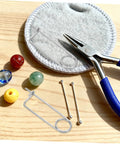 Cool Heavy Duty Stainless Steel Cotter Safety Pin Lot 20pcs For Farm Hitch And Industrial Machinery Lock Anti vibration Spring Pins That Won't Budge Or Loosen No Matter What, displayed with assorted beads and pliers.