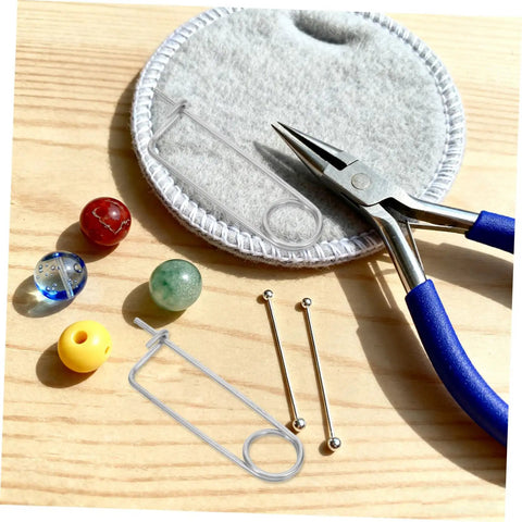 Cool Heavy Duty Stainless Steel Cotter Safety Pin Lot 20pcs For Farm Hitch And Industrial Machinery Lock Anti vibration Spring Pins That Won't Budge Or Loosen No Matter What, displayed with assorted beads and pliers.