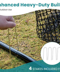 Person installing Backyard Golf Net 10x7 Ft With Frame For Indoor And Outdoor Practice, easy setup with stakes on grass.