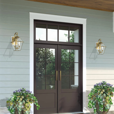 Westover 2-Light Outdoor Wall Lantern in antique brass, mounted beside patio door, handcrafted solid brass fixture, traditional design