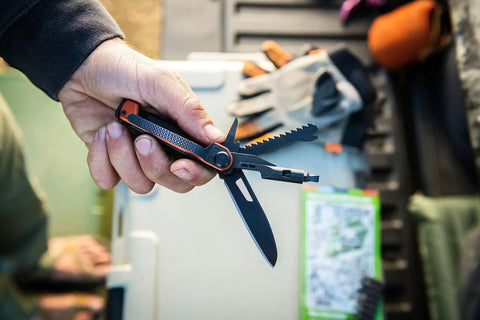 Person holding 8 In 1 EDC Multitool Pocket Knife with Blade Pry Bar Hammer Saw Bottle Opener, burnt orange, for camping.