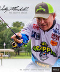 Angler using Crappie Thunder Underspin Fishing Reel With 4.3 To 1 Gear Ratio For Right Or Left Hand Retrieve In Green
