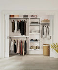 Solid Wood Cut To Fit Closet Storage Kit In Clean White Featuring reinforced garment bars, shelves, and organized clothing.