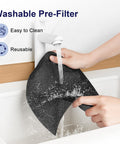 Person washing washable pre-filter of a Large Room Air Purifier With HEPA H13 Filtration