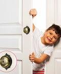Child smiling next to Vintage Victorian Twist Bell With Key Plate Mechanical Doorbell For Home Brass Calling Bell on door