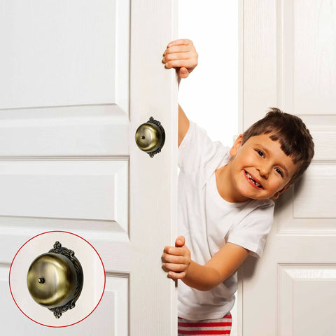 Child smiling next to Vintage Victorian Twist Bell With Key Plate Mechanical Doorbell For Home Brass Calling Bell on door