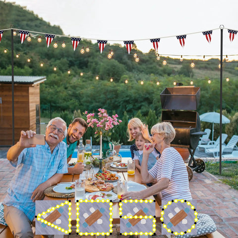 2 Pack Outdoor String Light Poles 10.5 Ft Spiral Screw In Stakes for patio party lighting, showing family dinner under lights