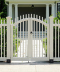 White fence gate with Heavy Duty Concrete Fence Post Base 4x4 Inches Four Pack, Steel Post Anchor Holder For Pergolas at base