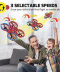 Father and son control Kids Mini Drone With Altitude Hold And Headless Mode, Two Batteries, Full Propeller Guards indoors.