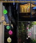 Solar Disco Ball Garden Light With Color Changing LEDs For Outdoor Patio Decor shown hanging in a garden at night.