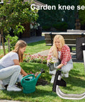 Foldable Kneeler Stool With Thick Foam Pad And Cushioned Seat For Seniors used in yard work near flower garden.