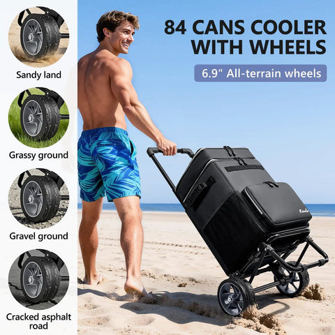 Man pulling a large collapsible soft-sided cooler on wheels with a big 7-inch wheel, 84 can capacity for varied terrains on beach.