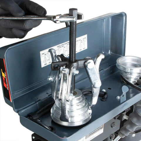 Beefy Built Tough Gear Puller Set 3 Jaw 4 Piece With 3 4 6 And 8 Inch Reversible Pullers for auto repair in use on machinery