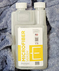Ultra Premium Microfiber Towel Wash Detergent 16oz For Towels Cloths And Buffing Pads Concentrated Pre Soak Formula bottle on microfiber towel