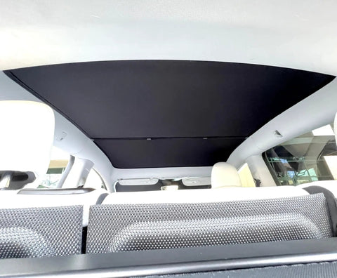 Custom Tailored Four Piece Tesla Model Y Sunroof Solar Shades In Slick Light Grey Featuring Retractable Glides And Nifty Center Locking Magnets for UV protection inside the car.