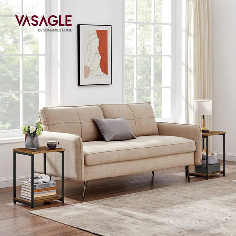 Living room with a beige sofa and set of two industrial style end tables with rustic brown tops and matte black steel frames.