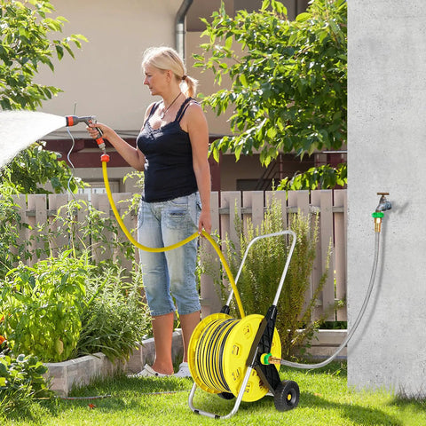 Woman using garden hose reel with 3Ft Short Garden Hose With Double Female Connectors For Quick Hose Reel Setup Workhorse Heavy Duty