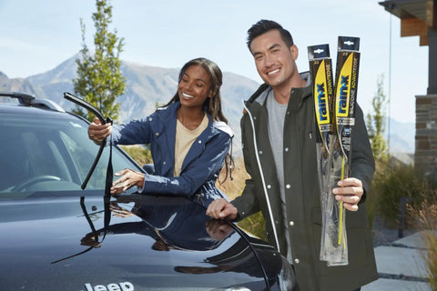 Tough As Nails Silicone Wiper Blade Replacement 26 Inch Premium Beam Design installed by couple on SUV windshield.