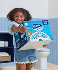 Child holding Ultra Soft Forever Roll Starter Kit with Brushed Stainless Steel Holder and Two Ply Forever Rolls in bathroom.