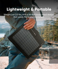 Person holding 40W Air Foldable Solar Panel Kit With Book Sized PERC Bifacial Cells in nature, showcasing portable lightweight design.