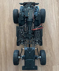 Top view of 1/10 RC crawler showing metal chassis and components for Rear Sway Bar And Anti Tilt Link Kit For 1 By 10 RC Crawlers Aluminum Alloy Upgrade For Axial Wraith RR10 Yeti And Vanquish VS4 10 Phoenix LCG DIY Bolt On Replacement To Improve Stability And Handling.