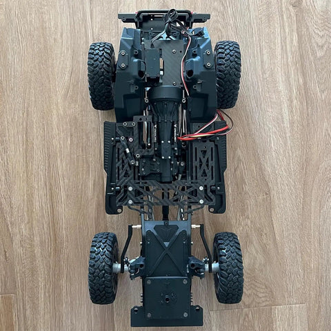 Top view of 1/10 RC crawler showing metal chassis and components for Rear Sway Bar And Anti Tilt Link Kit For 1 By 10 RC Crawlers Aluminum Alloy Upgrade For Axial Wraith RR10 Yeti And Vanquish VS4 10 Phoenix LCG DIY Bolt On Replacement To Improve Stability And Handling.