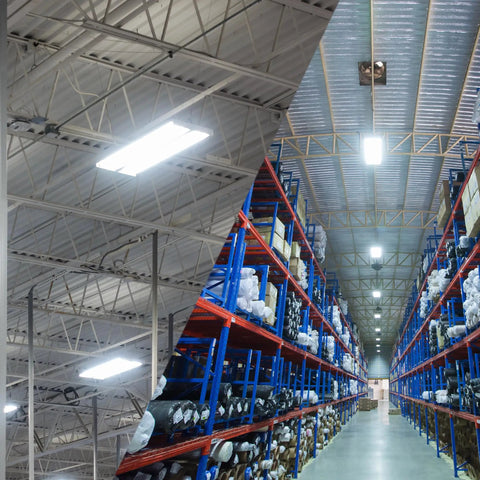 Interior view of a warehouse with installed Led Linear High Bay Light 2 Ft 24 Inch 150W Equivalent, bright lighting overhead
