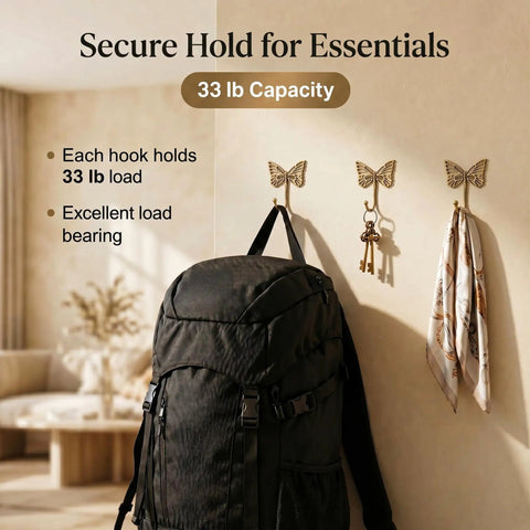 Solid Brass Butterfly Wall Hooks With 33 Lb Capacity, Vintage Gold Finish, showcasing secure hold for backpack and keys