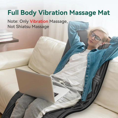 Person relaxing on a sofa using Full Body Massage Pad For Bed With 10 Vibration Motors And 5 Massage Modes, Heated Mattress Pad For Back And Whole Body, Auto Shut Off, Chill Out Comfort Gift For Men And Women.
