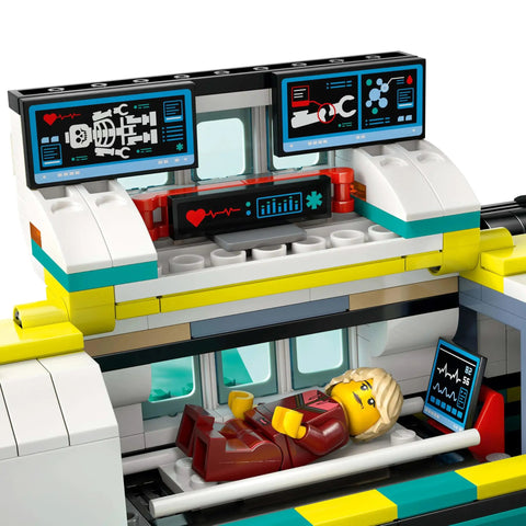 Sky Rescue Air Ambulance Building Blocks Toy Set interior with mini-figure on stretcher and medical monitors above.