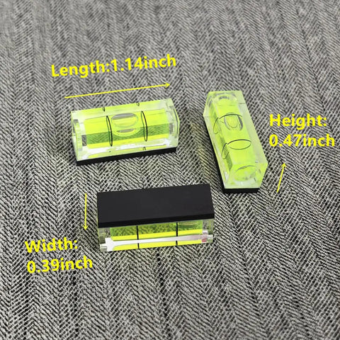 Top Tier 5 Piece Set Of Mini Magnetic Bubble Levels with detailed measurements on a textured background.