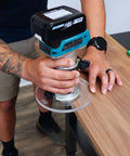 Top Shelf 6 Inch Round Router Base Plate For Makita Rt0701c And Xtr01z Compacts in use on a wooden surface.