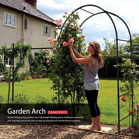 Woman arranging flowers on Sturdy Garden Arch Trellis For Climbing Plants Outdoor Wedding Arches Ceremony Decor Black Metal Garden Arbor 7.9 Ft Wide By 6.4 Ft High