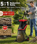 Powerful 15 Amp Electric Wood Chipper Shredder With 4200 RPM in use by man in garden, showcasing 1.75 inch branch capacity.