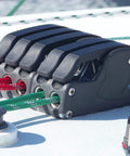 Spinlock XTS rope clutch, single alloy deck hardware, side view with red and green lines.