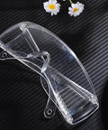 Six Pair Safety Glasses With Ventilated Louvered Frames And Wraparound Side Shields For Lab Projects And Shop Work Impact Resistive Clear Lenses on black background.