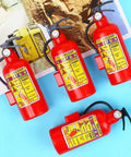 Twelve Piece Haul Of Realistic Mini Fire Extinguisher Water Squirt Guns For Kids Summer Pool Parties and Beach Bash Favors on blue background.