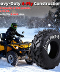 All Terrain 19x7-8 ATV UTV Tires 4PR Tubeless Off Road Set For 8 Inch Rims displayed beside an ATV on a snowy trail
