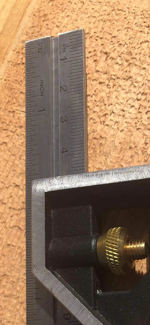 Close-up of 6-Inch Combo Square With Stainless Steel Rule Cast Zinc Body Bubble Vial And Brass Bolt on wooden surface