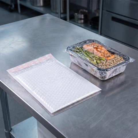 White Bubble Mailers 30 Pack 6x8 Inch Padded Envelopes For Small Biz Shipping beside food tray on metal table